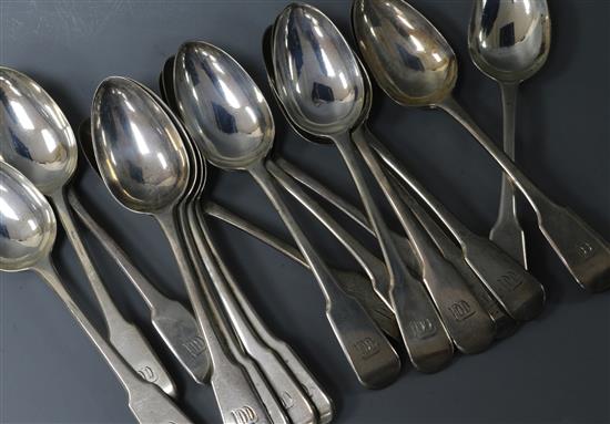 A set of eighteen George III silver fiddle pattern dessert spoons, Eley, Fearn & Chawner, 23.5 oz.